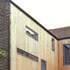 Larch clad breathing wall system with Danish timber windows.
