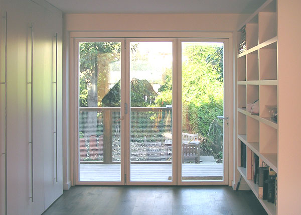 White lacquered wardrobe and shelving unit.
