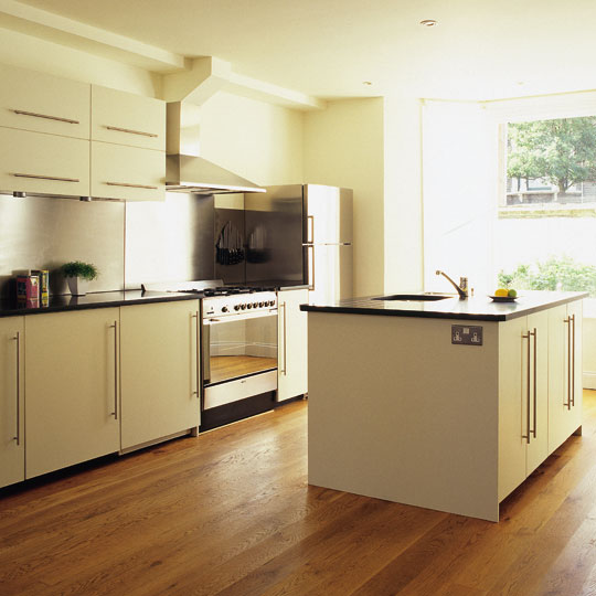 Oak floors, granite worktops, stainless steel splashbacks and handmade lacquered cabinets.
