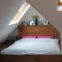 Elm bed built into an existing angled dormer.
